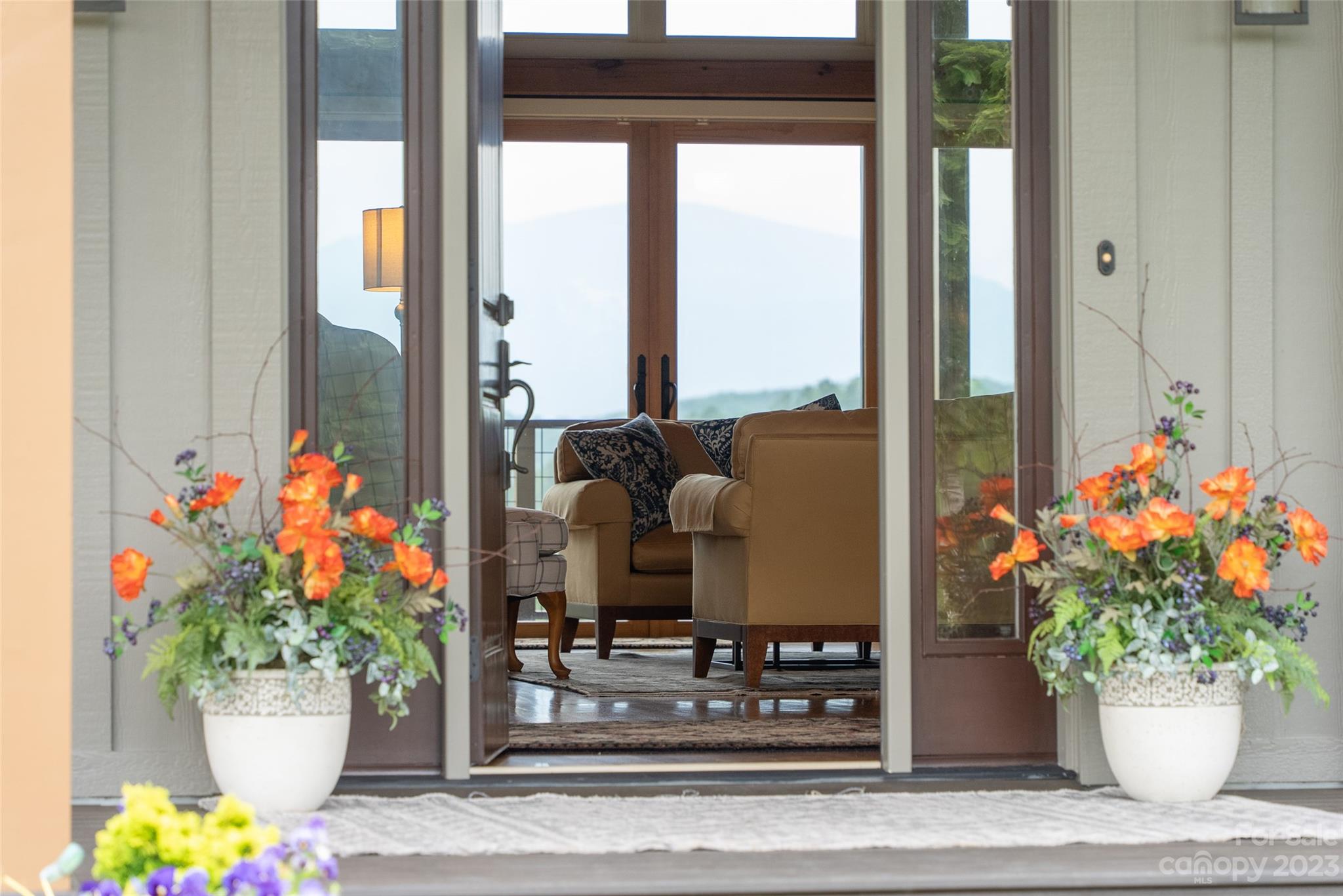 285 Red Tail Trail Mill Spring Mill Spring, NC 28756 - Photo 8 of 48 a vase of flowers sitting on a table with a potted plant