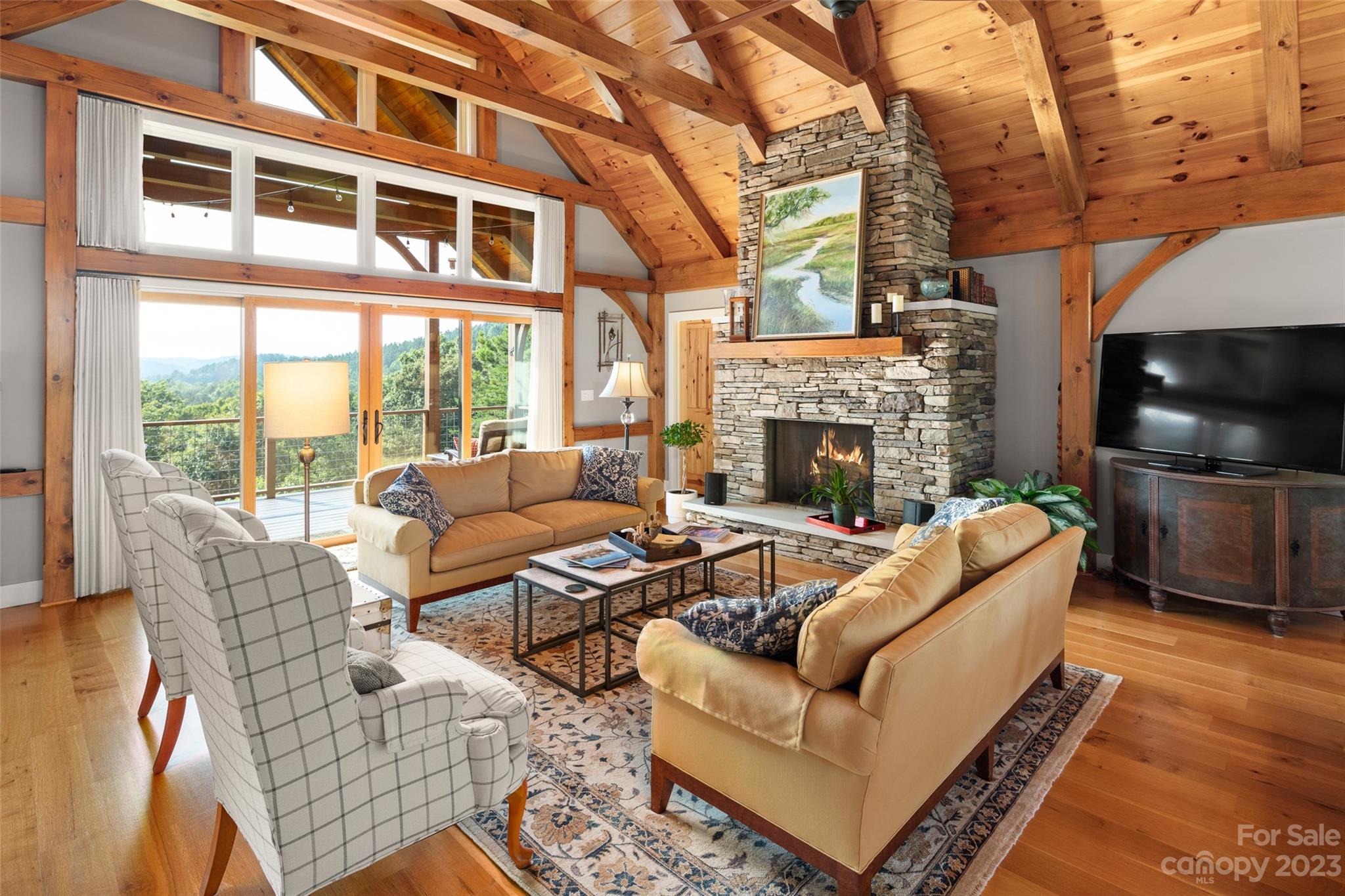 285 Red Tail Trail Mill Spring Mill Spring, NC 28756 - Photo 9 of 48 a living room with furniture a fireplace and a flat screen tv