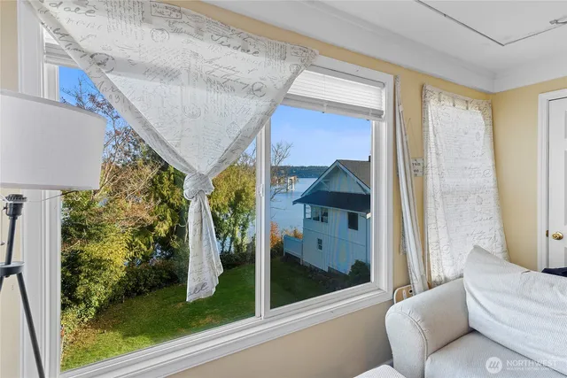 a living room with a couch and a large window