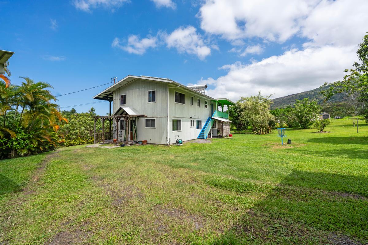 83-5434 Middle Keei Road Captain Cook, HI 96704 - Photo 16 of 30 a front view of a house with a yard