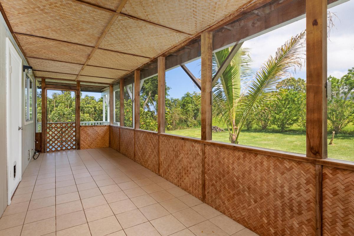 83-5434 Middle Keei Road Captain Cook, HI 96704 - Photo 25 of 30 a view of a porch with wooden floor and outdoor space