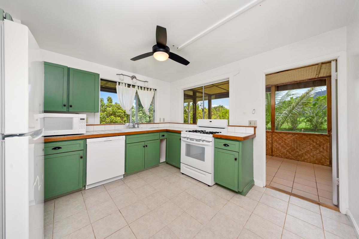 83-5434 Middle Keei Road Captain Cook, HI 96704 - Photo 27 of 30 a kitchen with a sink and stove