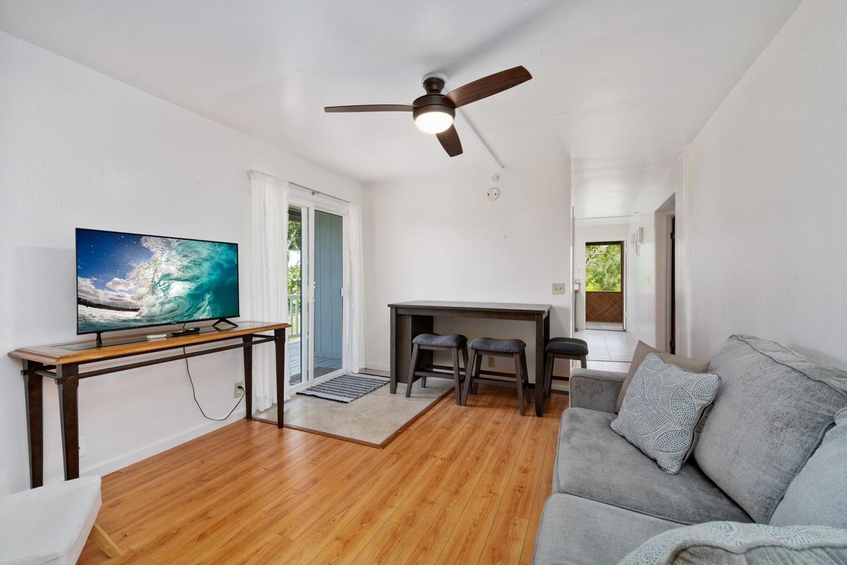 83-5434 Middle Keei Road Captain Cook, HI 96704 - Photo 28 of 30 a living room with furniture and a flat screen tv
