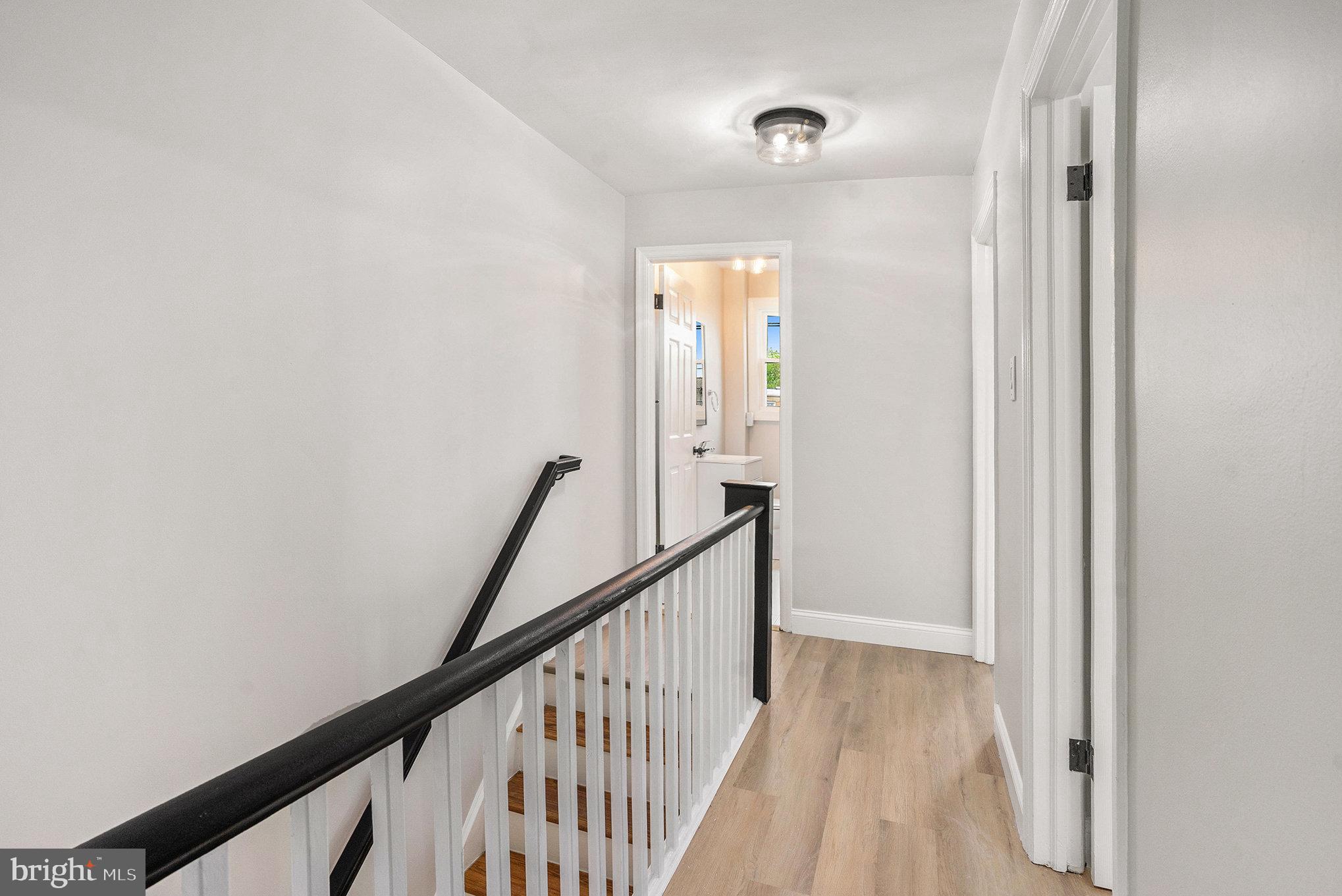 429 East 12th Avenue Conshohocken, PA 19428 - Photo 12 of 34 a view of a hallway with wooden floor and staircase