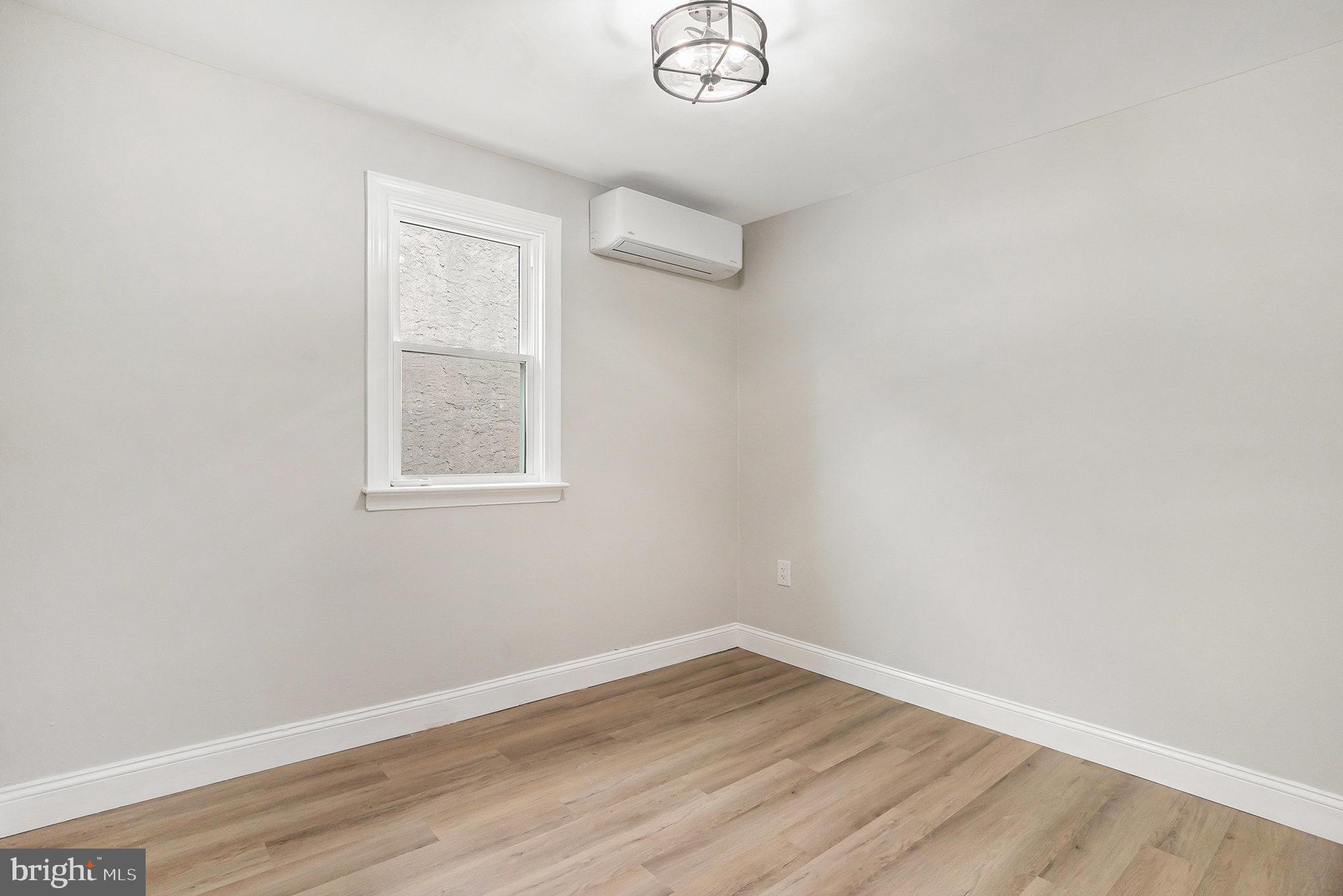 429 East 12th Avenue Conshohocken, PA 19428 - Photo 13 of 34 an empty room with wooden floor and windows