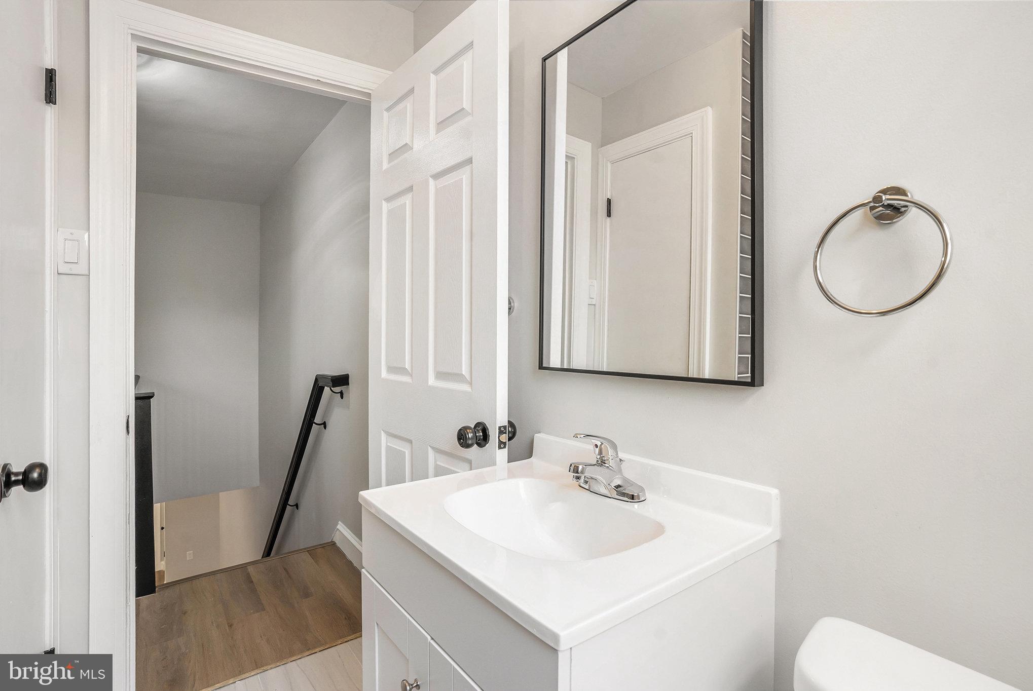 429 East 12th Avenue Conshohocken, PA 19428 - Photo 15 of 34 a bathroom with a sink a toilet and a mirror