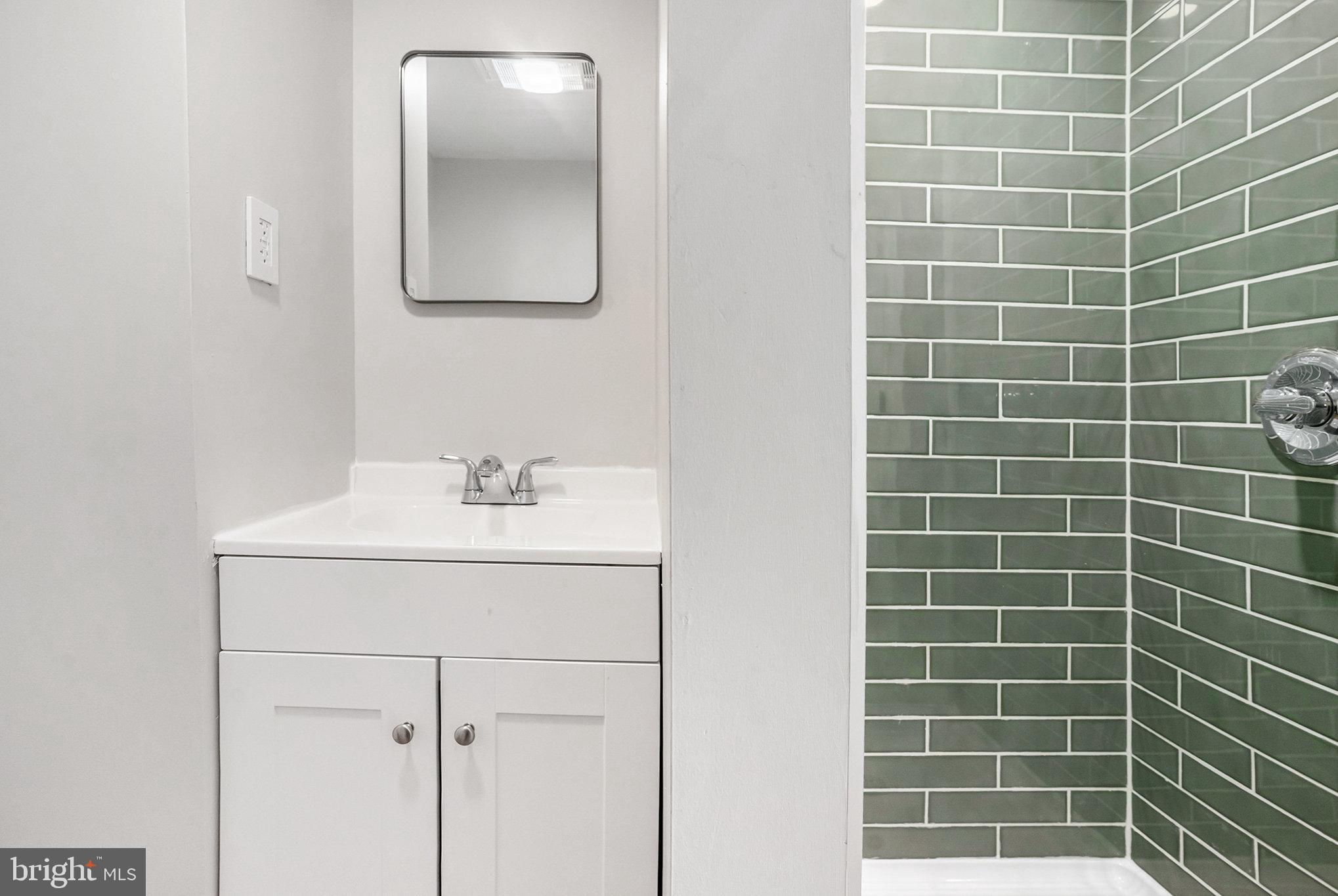 429 East 12th Avenue Conshohocken, PA 19428 - Photo 19 of 34 a bathroom with a sink and mirror