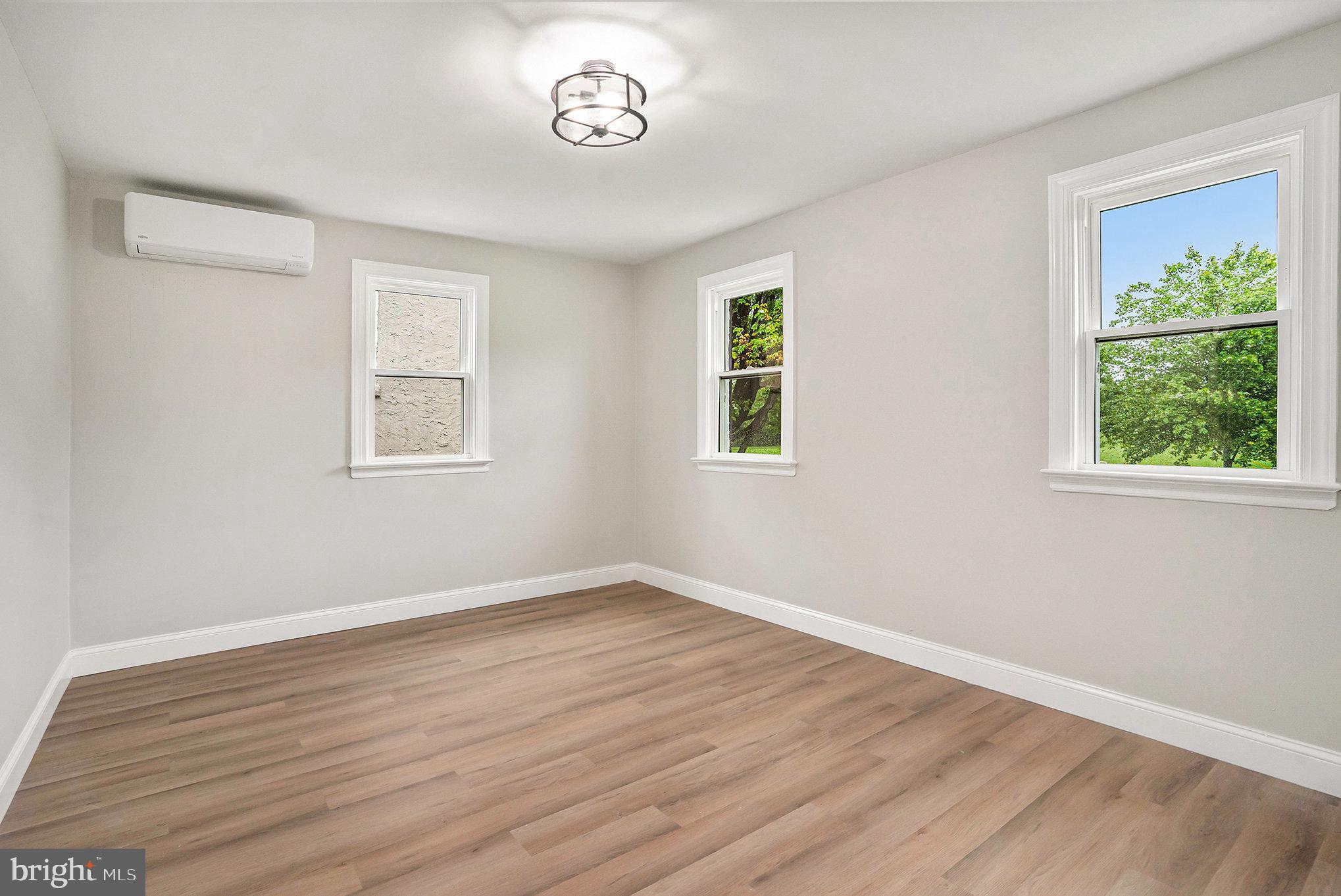 429 East 12th Avenue Conshohocken, PA 19428 - Photo 20 of 34 a view of an empty room with wooden floor and a window
