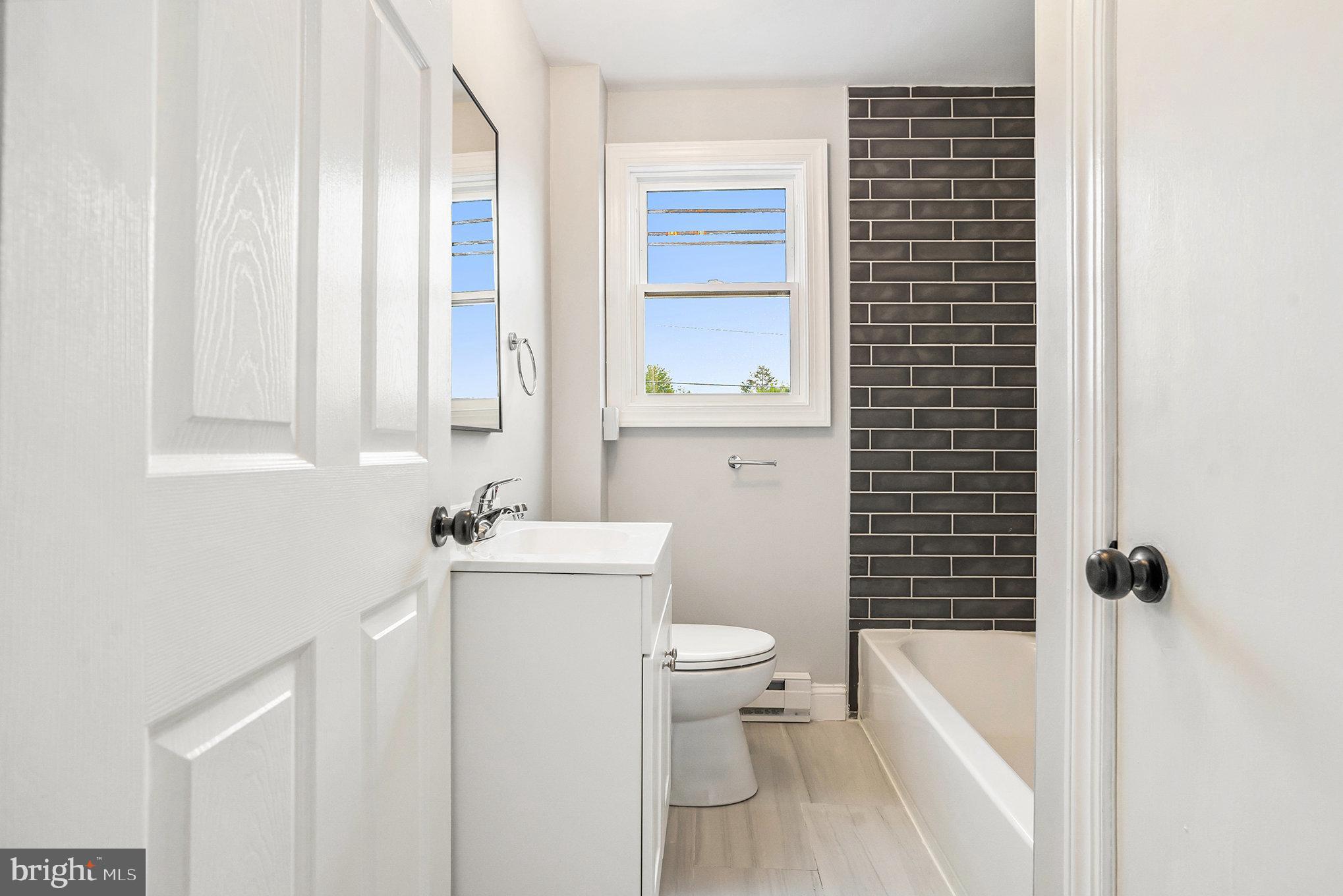 429 East 12th Avenue Conshohocken, PA 19428 - Photo 22 of 34 a bath room with a toilet a bath tub and a shower