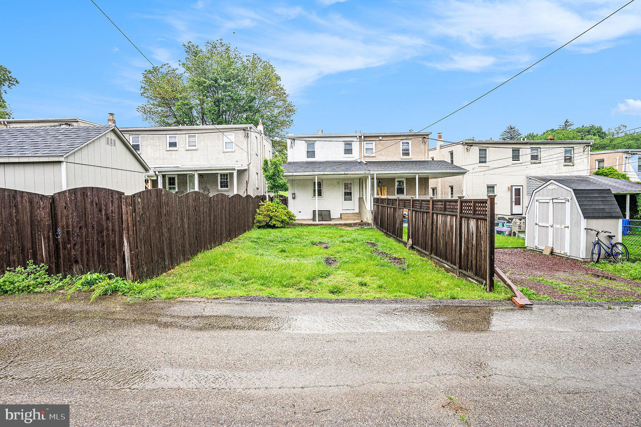 429 East 12th Avenue Conshohocken, PA 19428 - Photo 30 of 34 a view of a house with a small yard and wooden fence