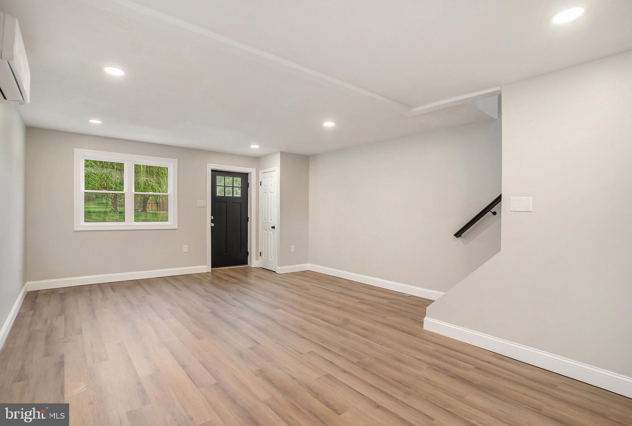 429 East 12th Avenue Conshohocken, PA 19428 - Photo 5 of 34 an empty room with wooden floor and windows