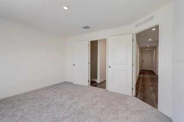 wooden floor and closet in a room