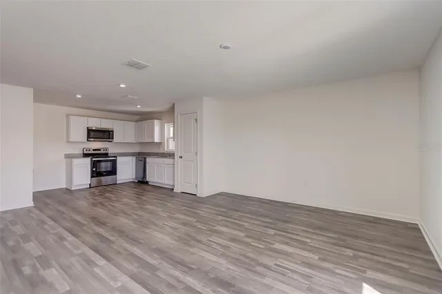 a view of kitchen with wooden floor