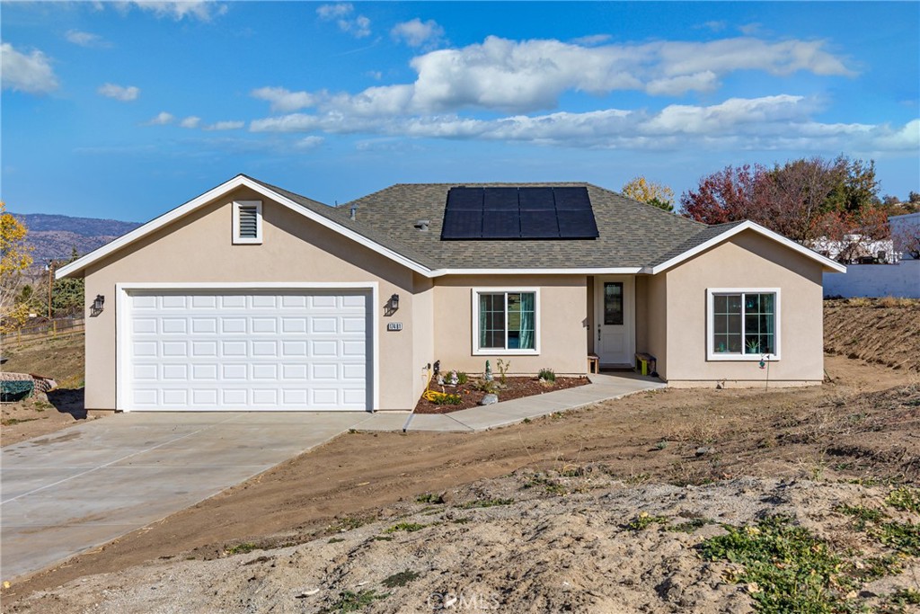 17481 Bold Venture Drive Tehachapi, CA 93561 - Photo 1 of 1 a front view of a house with a yard