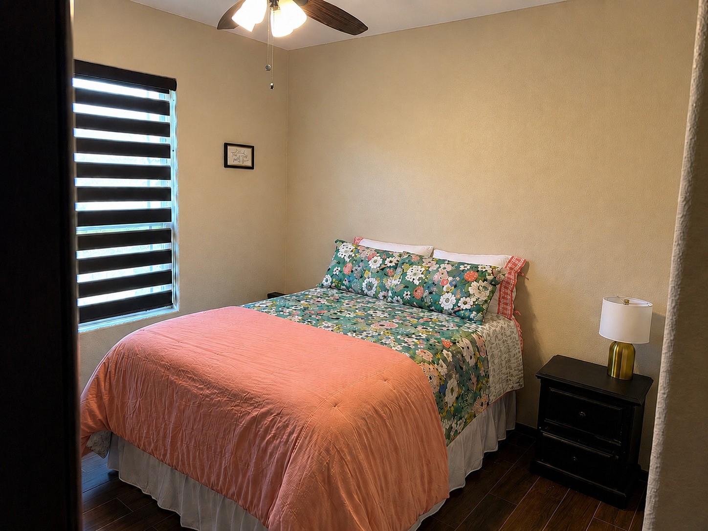 27656 Rio Blanco Drive Splendora, TX 77372 - Photo 14 of 18 Cozy bedroom with a warm color palette with a ceiling fan.