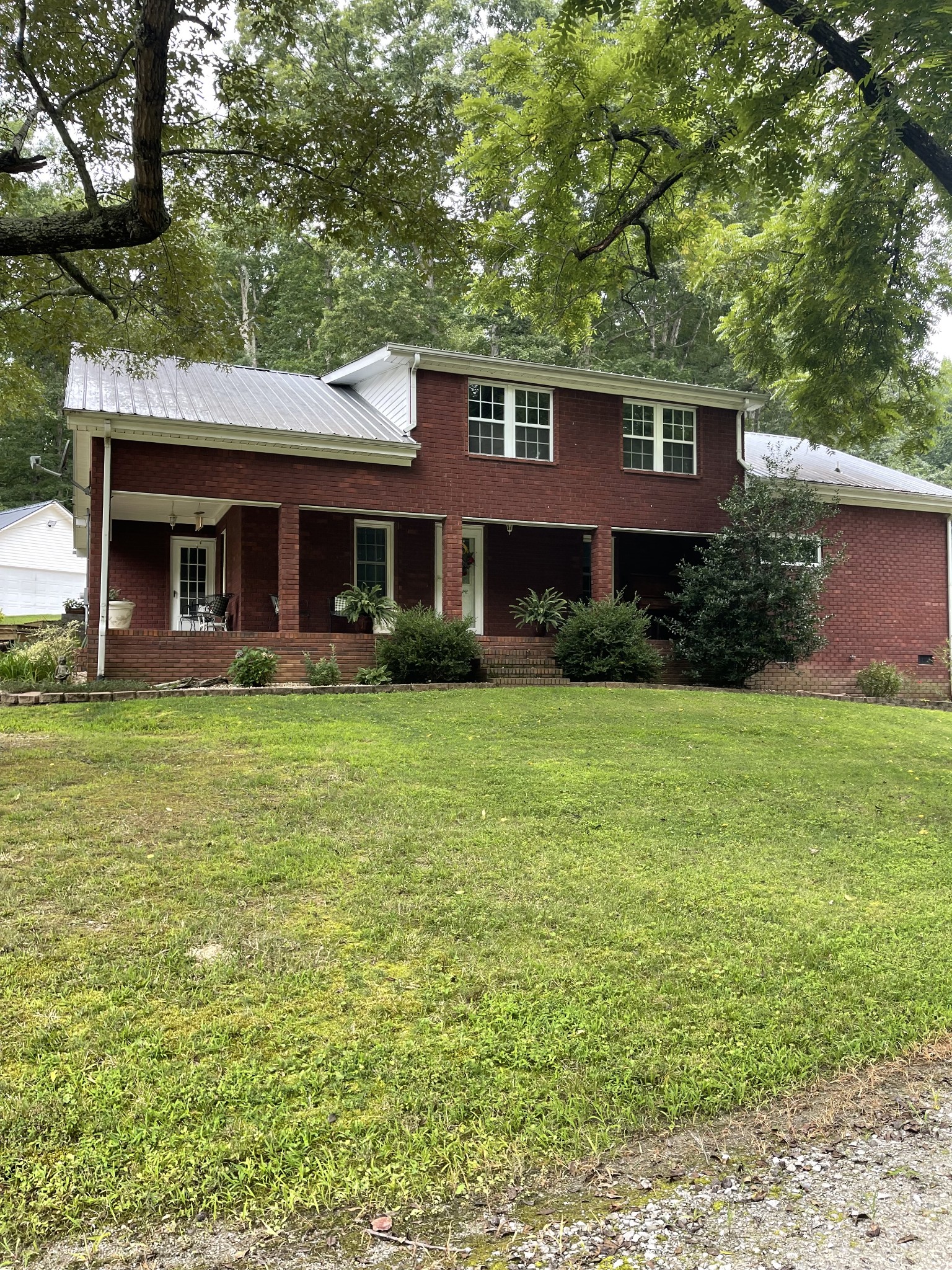 70 Price Jenkins Road Leoma, TN 38468 - Photo 3 of 36 a front view of a house with garden