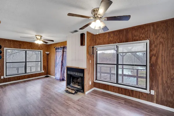a view of livingroom with hardwood floor and a ceiling fan
