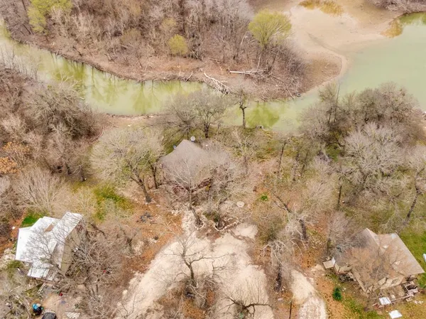 a view of a lake with a yard