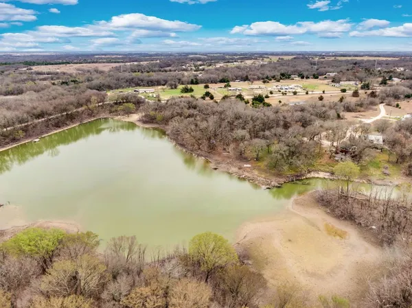 a kitchen with wooden cabinets and a stove