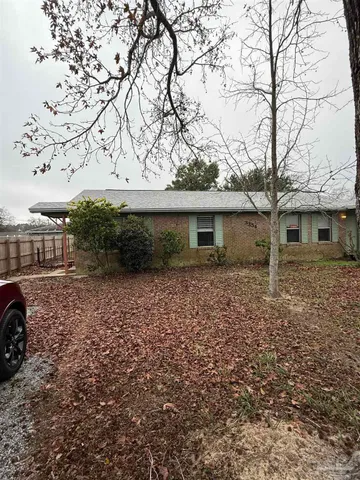 front view of a house with a dry yard