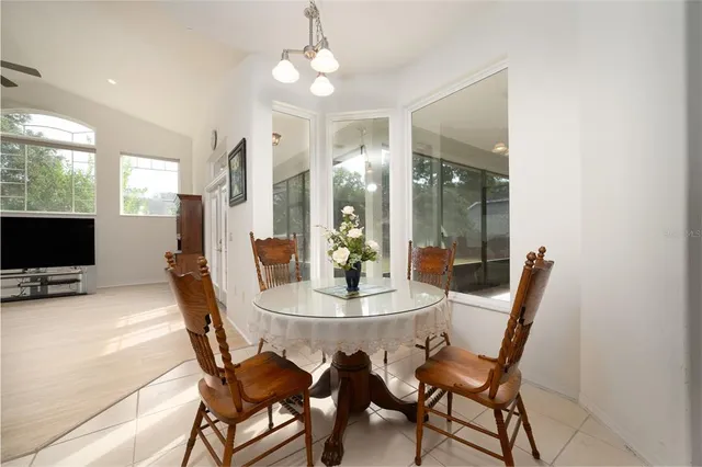 a dining room with furniture and window