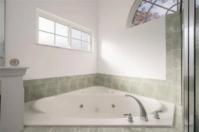 a white bath tub sitting in a bathroom