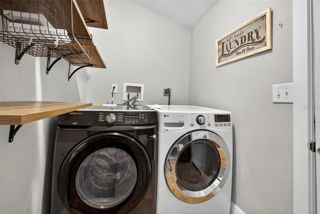 a utility room with dryer and washer