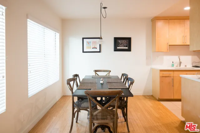 a view of a dining room with furniture and window