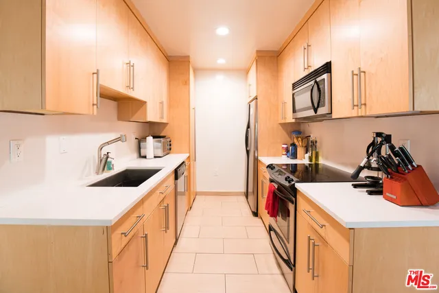 a kitchen that has a lot of cabinets