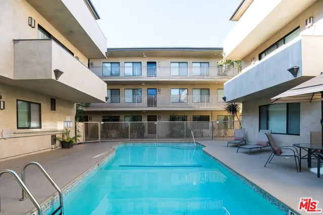 a view of house with a outdoor seating