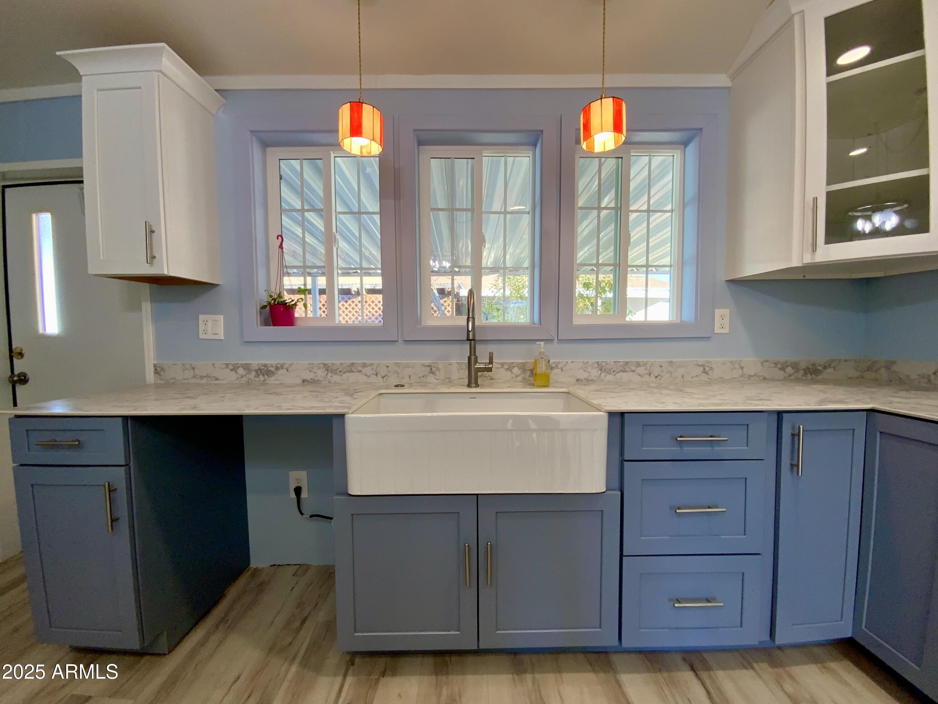 723 Finnie Flat Road, Unit 132 Camp Verde, AZ 86322 - Photo 22 of 58 a kitchen with a sink cabinets and window