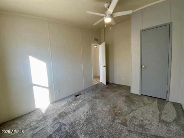 723 Finnie Flat Road, Unit 132 Camp Verde, AZ 86322 - Photo 40 of 58 an empty room with windows and fan
