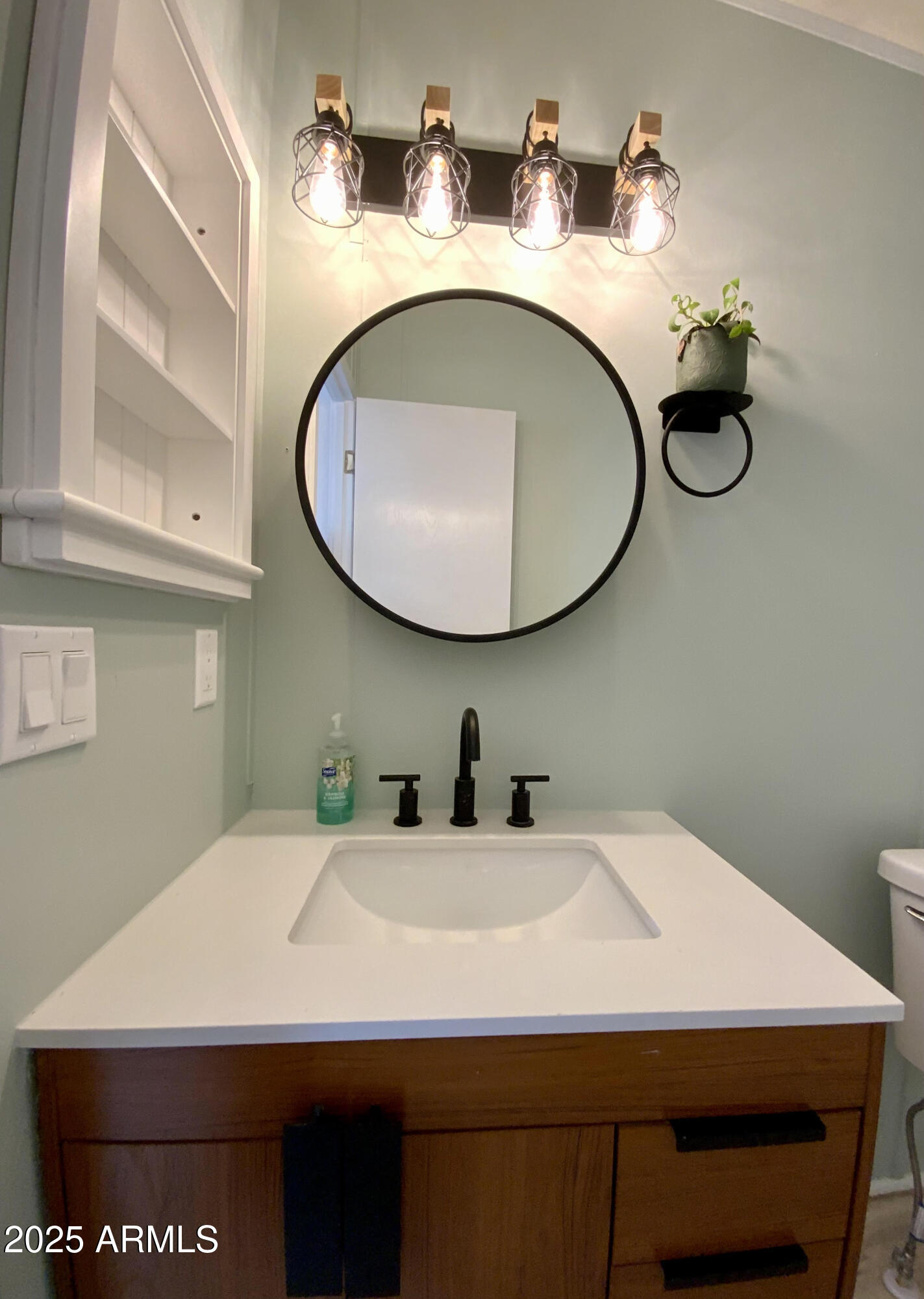 723 Finnie Flat Road, Unit 132 Camp Verde, AZ 86322 - Photo 48 of 58 a bathroom with a sink and a mirror