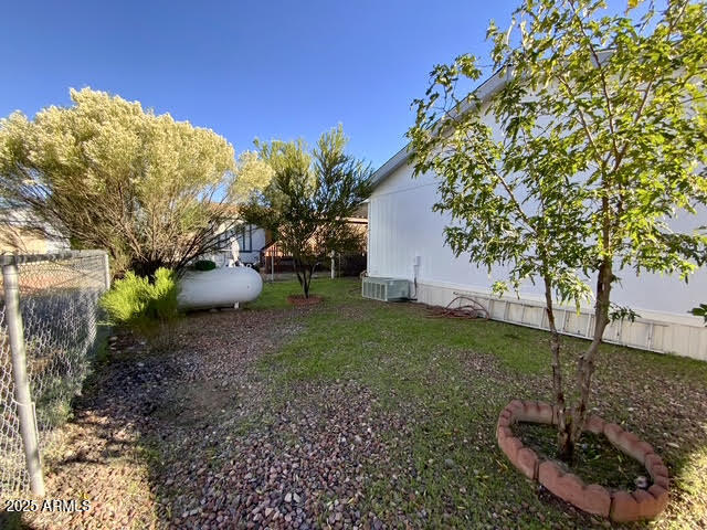 723 Finnie Flat Road, Unit 132 Camp Verde, AZ 86322 - Photo 56 of 58 a view of a backyard with plants and tree