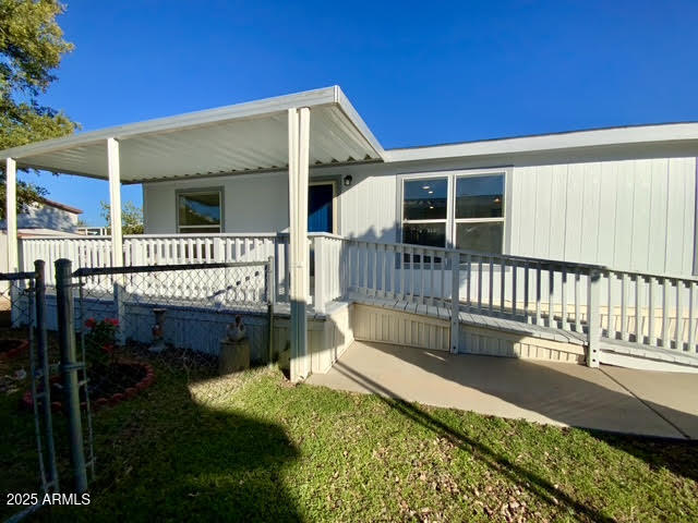 723 Finnie Flat Road, Unit 132 Camp Verde, AZ 86322 - Photo 9 of 58 a view of a house with a wooden deck