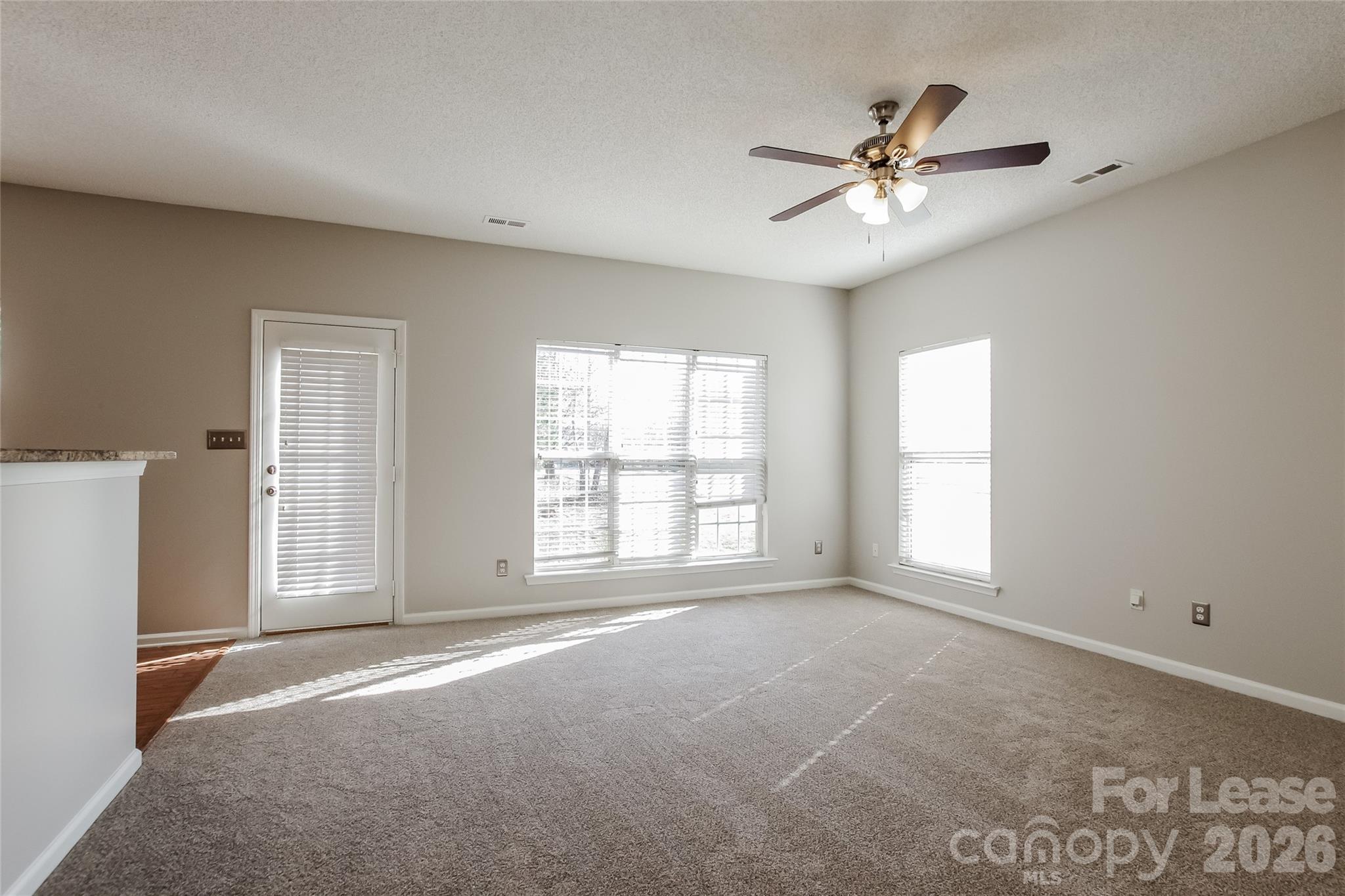 10802 Gold Pan Road Charlotte, NC 28215 - Photo 6 of 15 a view of an empty room with a window
