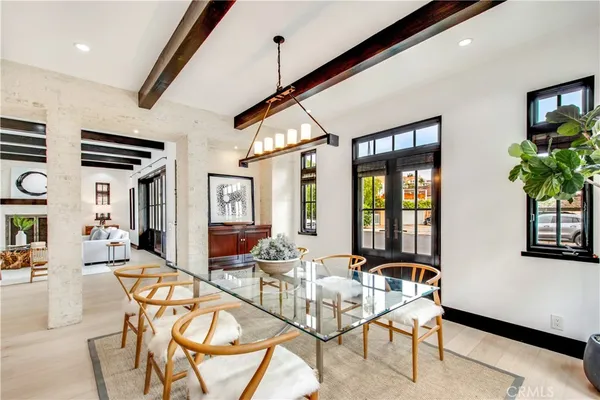 a view of a livingroom with furniture and floor to ceiling window