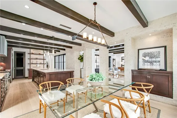 a bedroom with a bed lamp and a potted plant