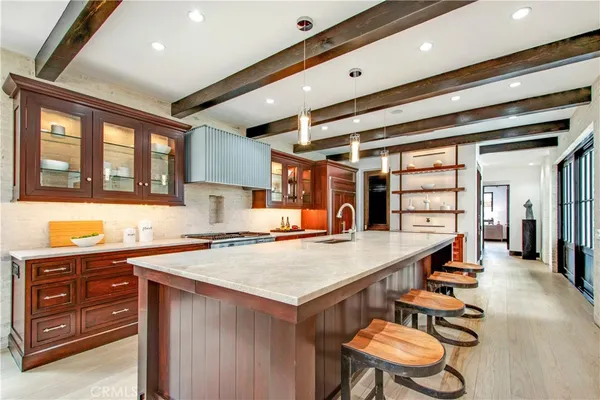 a bedroom with a bed lamp and a large window