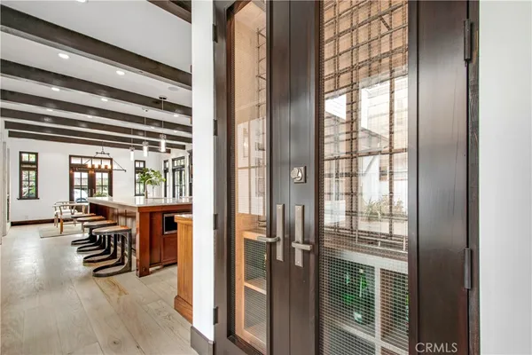 a bedroom with a bed a couch and potted plant with the outer view