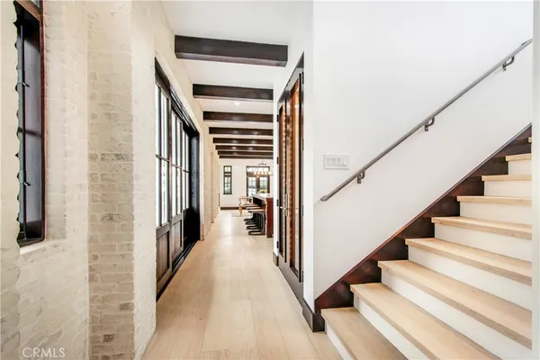 a spacious bedroom with a bed a couch and dresser