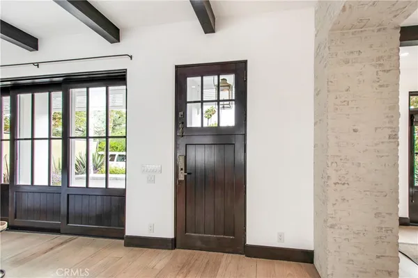 a living room with furniture a fireplace and a table