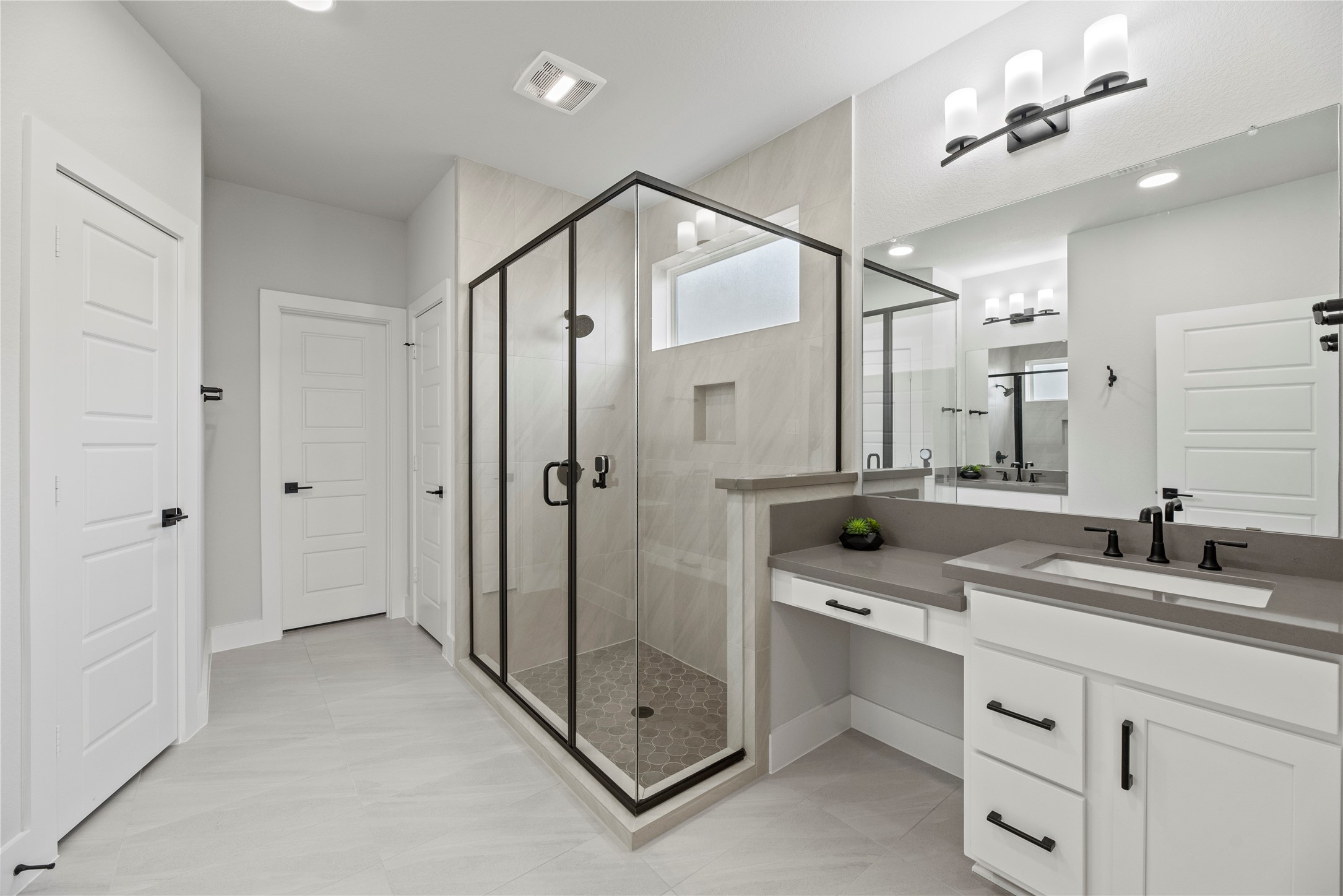 30155 GOLD FINCH Place Fulshear, TX 77441 - Photo 13 of 26 Step into your private bathroom with an oversized glass-enclosed shower with beautiful tile work throughout.