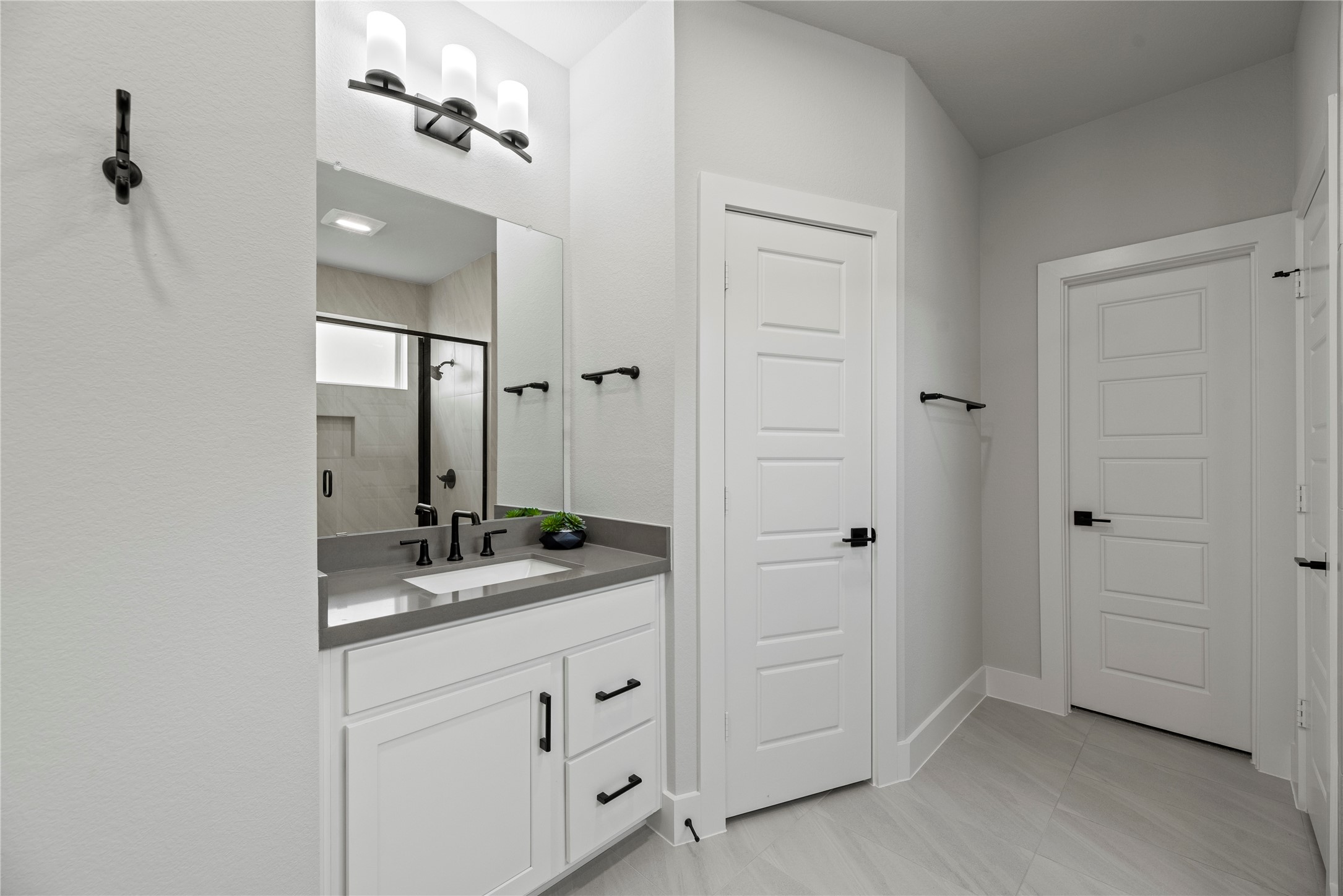 30155 GOLD FINCH Place Fulshear, TX 77441 - Photo 14 of 26 Separate vanities in your primary bath, offer personal space with tons of dedicated cabinet space.