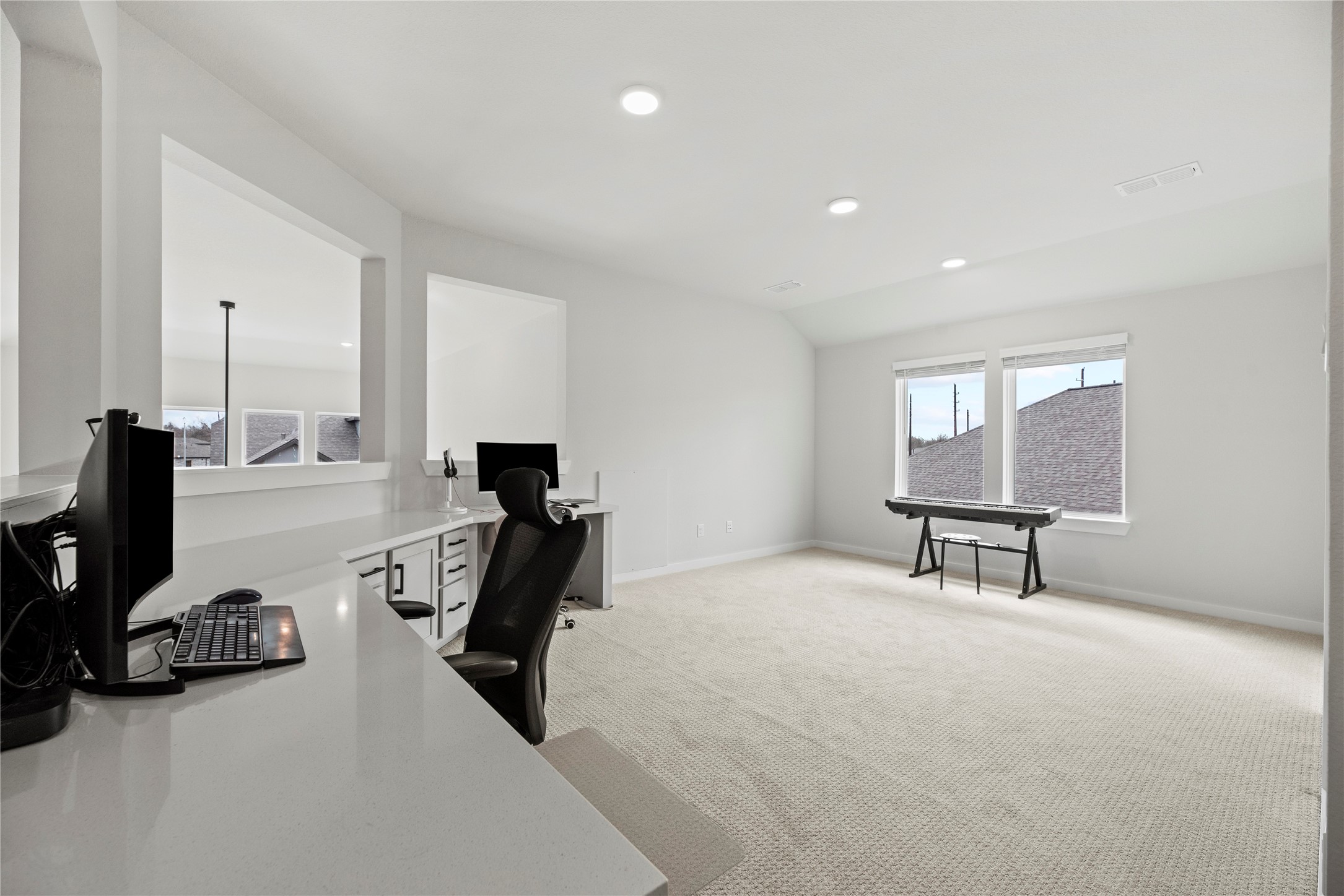 30155 GOLD FINCH Place Fulshear, TX 77441 - Photo 17 of 26 The whole family will love the expansive game room overlooking your living space below. This is a versatile space perfect for family fun or movie nights.