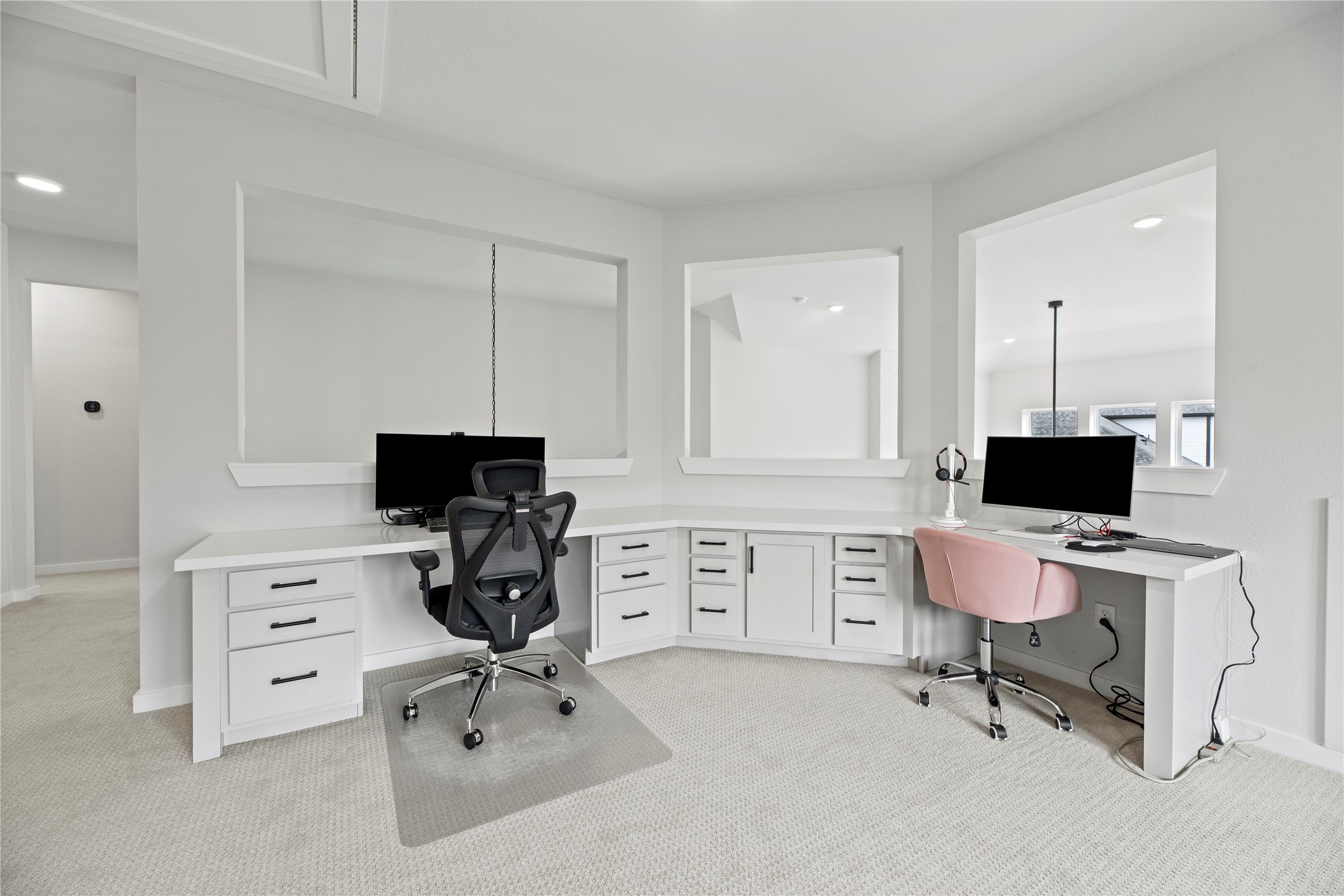 30155 GOLD FINCH Place Fulshear, TX 77441 - Photo 18 of 26 The built-in home office nook is thoughtfully designed, providing the perfect space for studying, remote work, or staying organized with ease and efficiency.