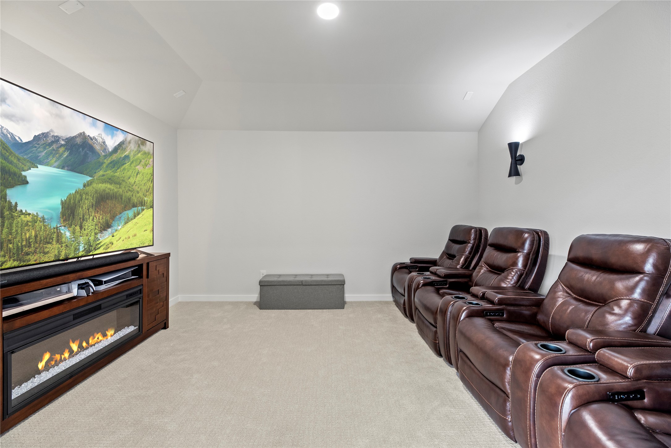 30155 GOLD FINCH Place Fulshear, TX 77441 - Photo 19 of 26 Just off the game room, the media room is pre-wired for sound, making it an ideal space for family movie nights or setting up your preferred entertainment system.