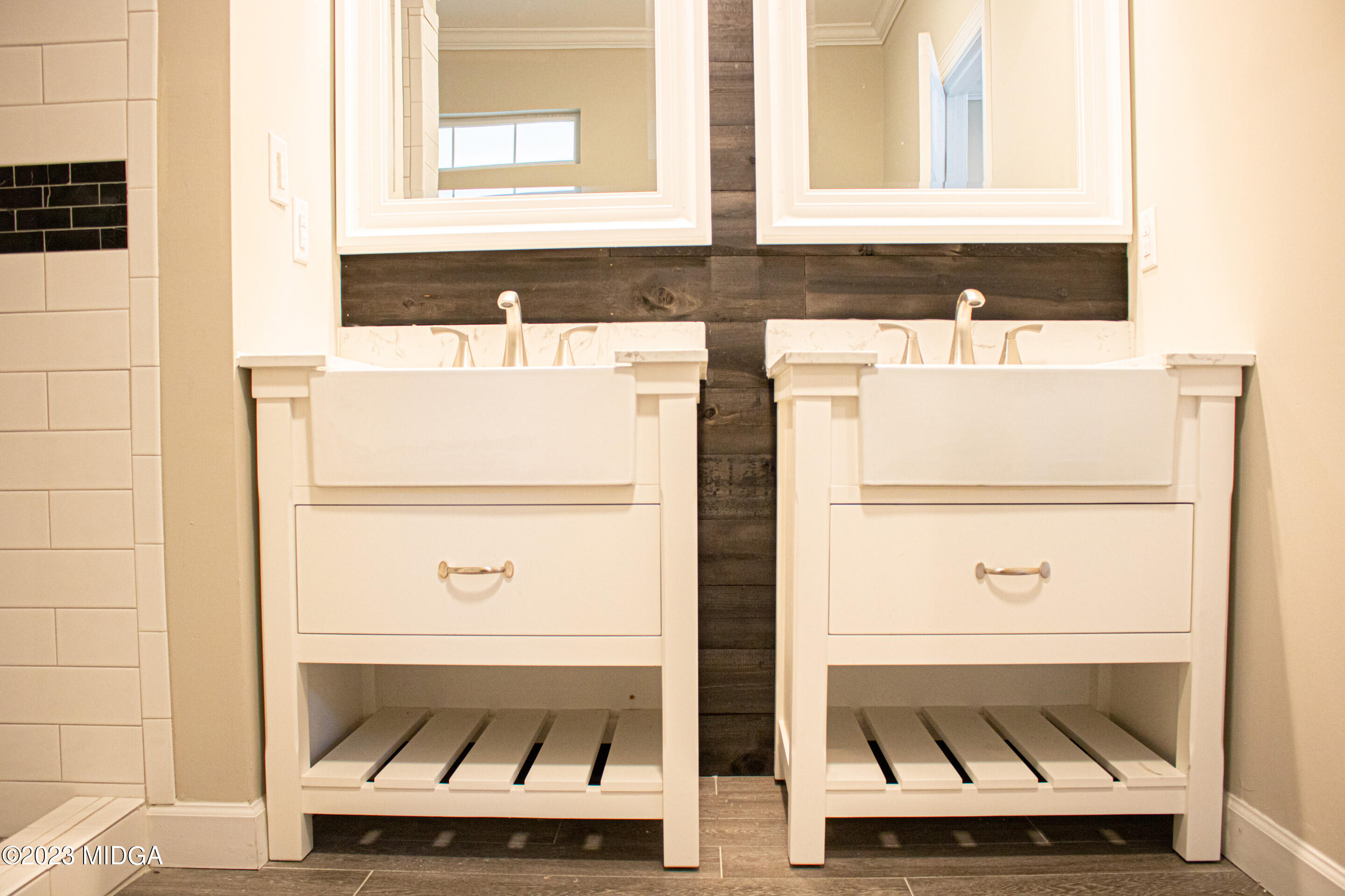 829 Lassiter Road Forsyth, GA 31029 - Photo 22 of 85 a bathroom with a sink and a mirror