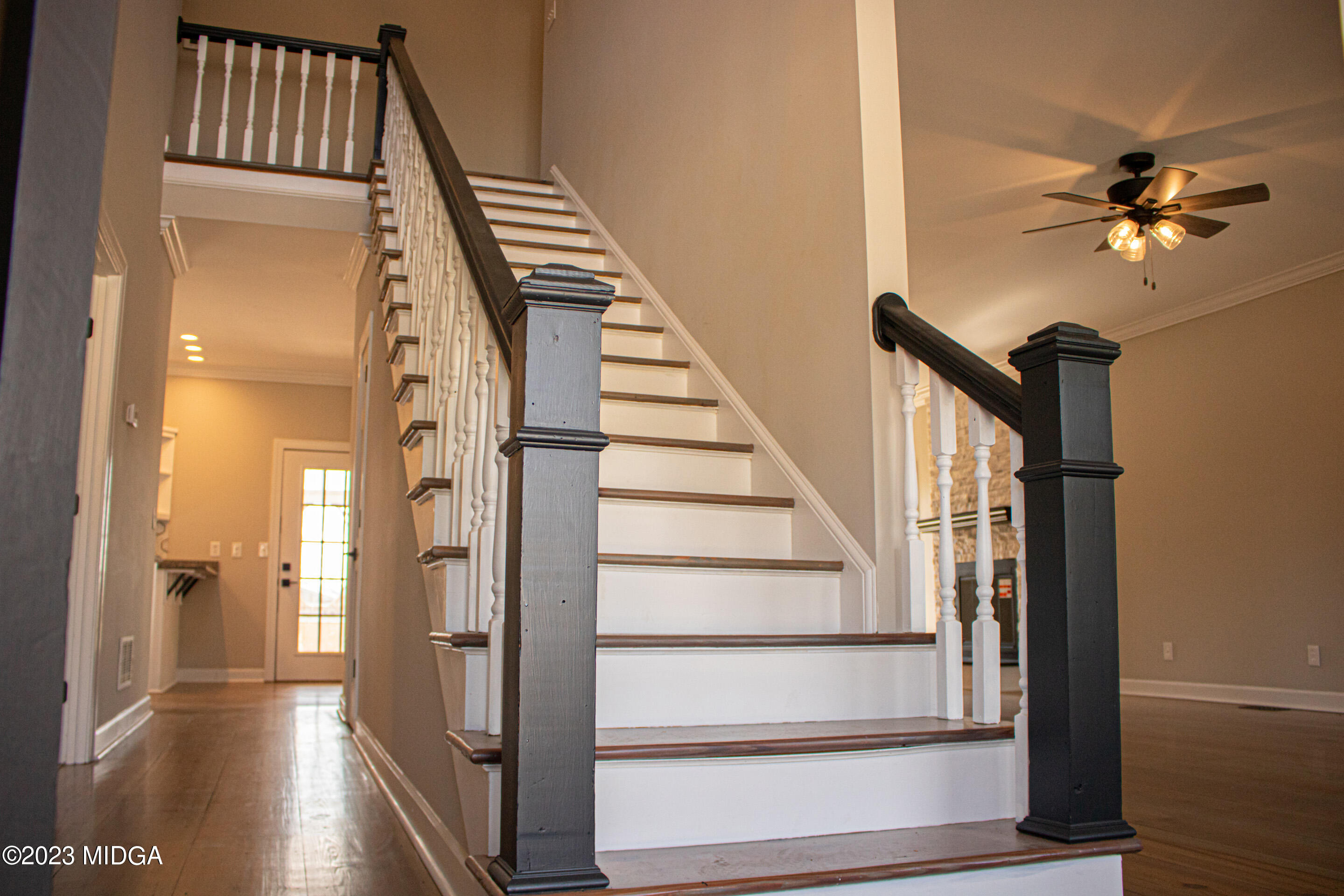 829 Lassiter Road Forsyth, GA 31029 - Photo 25 of 85 a view of staircase with white walls and a window