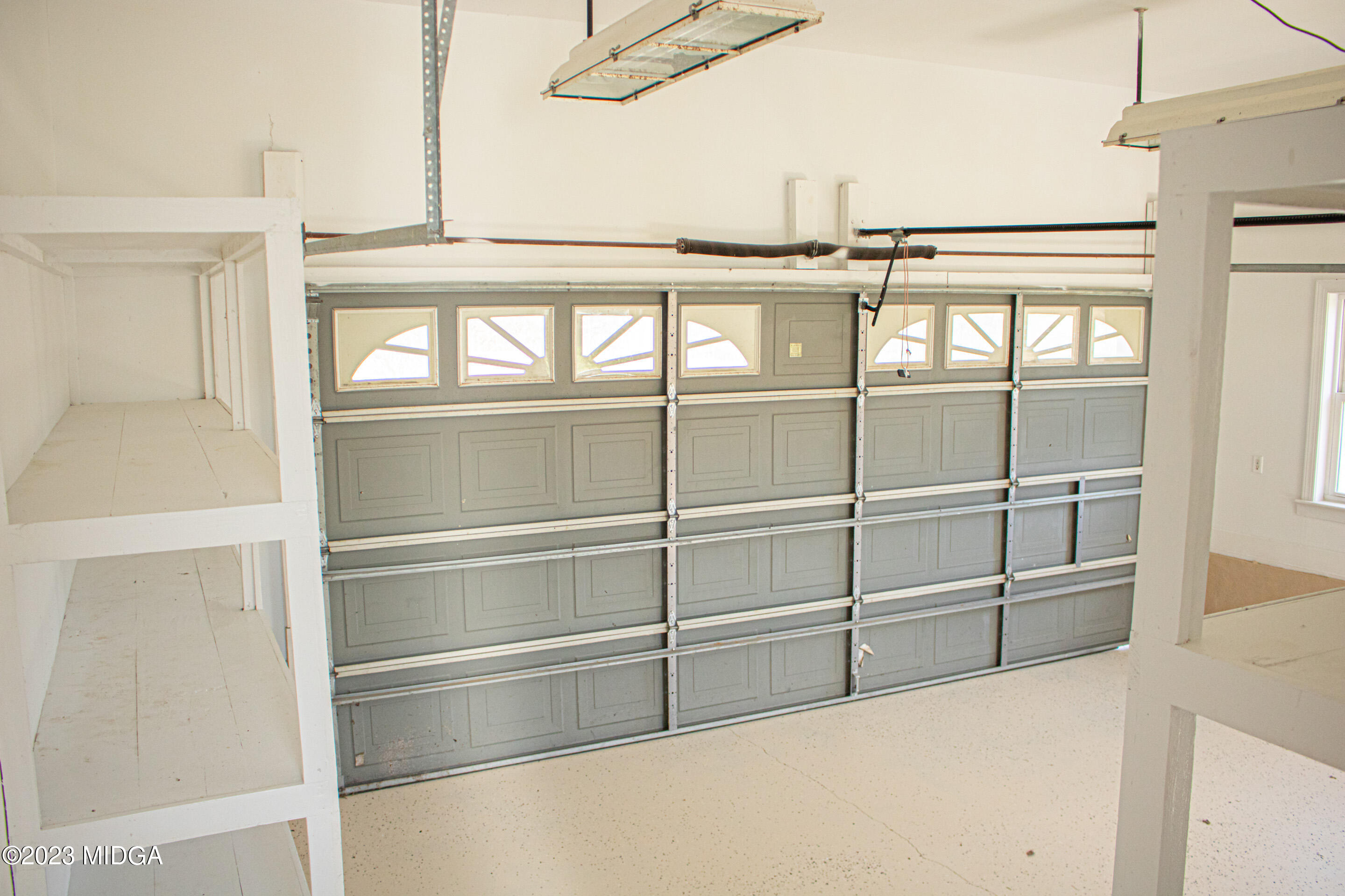 829 Lassiter Road Forsyth, GA 31029 - Photo 37 of 85 a view of walk in closet with empty racks